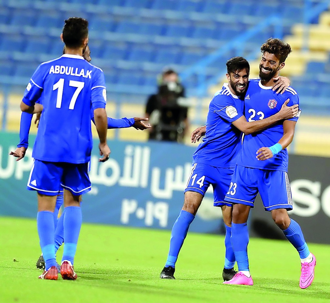 Al Shahania’s Ramin Einollah celebrates with team-mate Reza Najafi after scoring his second goal against Al Markhiya during the third round of the Amir Cup at the Thani bin Jassim Stadium in Doha, yesterday.
