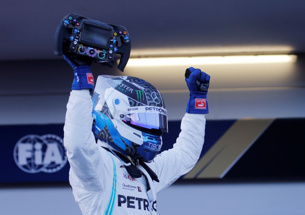 Mercedes' Valtteri Bottas celebrates winning the race REUTERS/Anton Vaganov