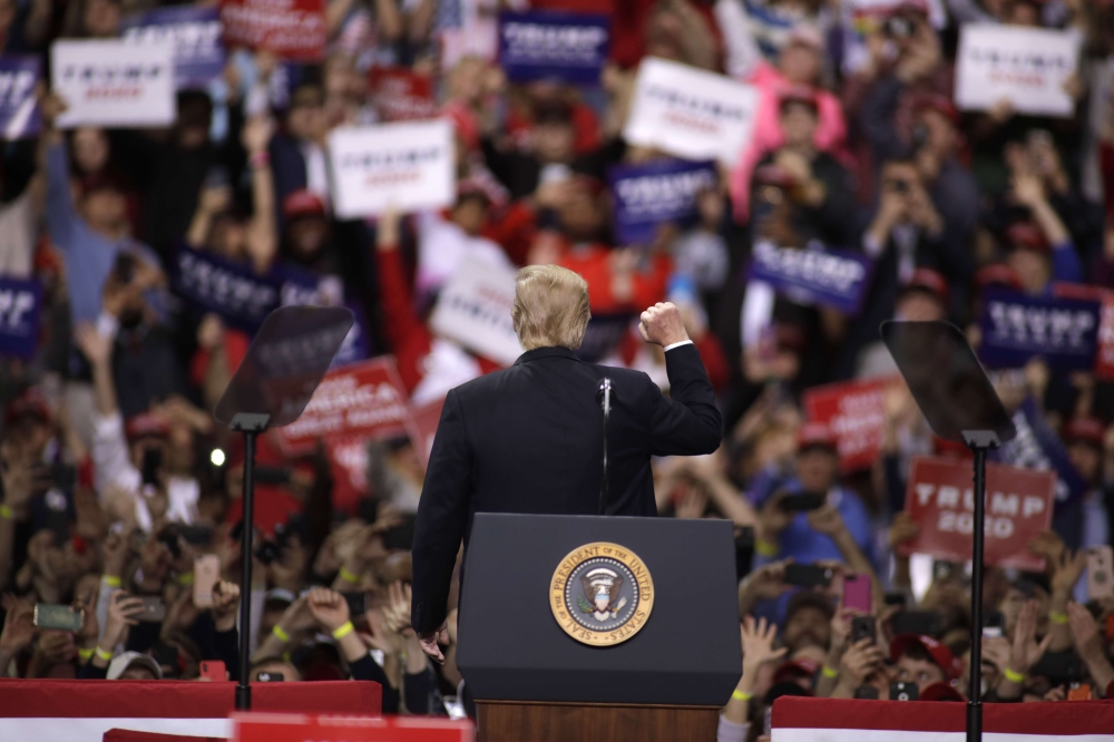 US President Donald Trump greets the crowd of supporters before he speaks at a Make America Great Again rally on April 27, 2019 in Green Bay, Wisconsin. Darren Hauck/AFP 