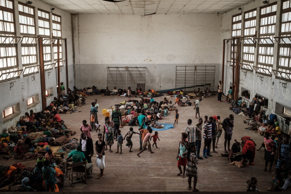 People of Buzi take shelter in the Samora M Machel secondary school, used as an evacuation center in Beira, Mozambique, on March 21, 2019 following the Cyclone Idai. AFP/Yasuyoshi Chiba