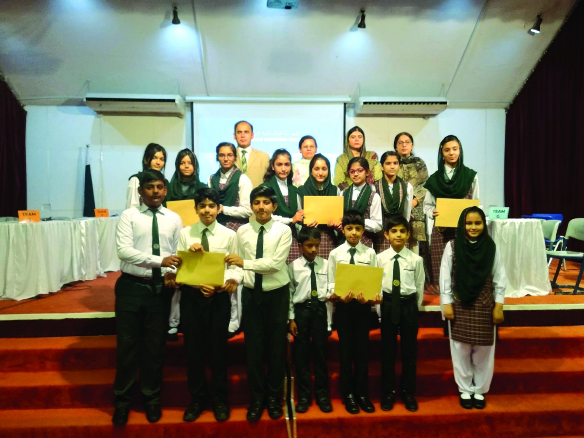 Nargis Raza Otho, Principal of Pakistan International School Qatar, with winners of the competition during the event. 