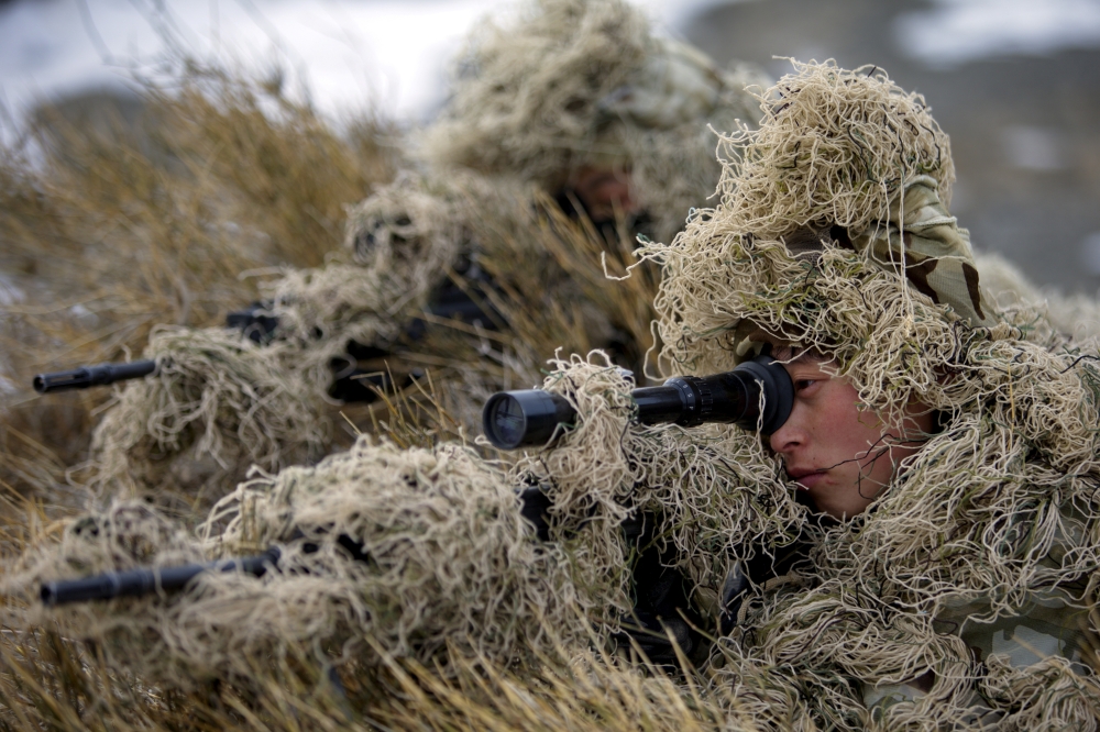 Soldiers of the People's Liberation Army (PLA) Marine Corps are seen in training at a military training base in Bayingol, Xinjiang Uighur Autonomous Region, January 20, 2016. Reuters