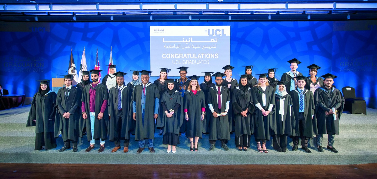 UCL Qatar’s new class of graduates pose for a group photo.