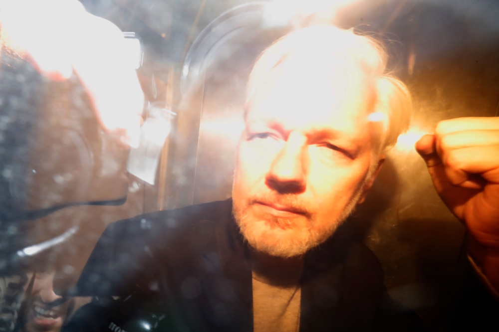 WikiLeaks founder Julian Assange arrives at court in London on May 1, 2019 to be sentenced for bail violation. AFP / Tolga AKMEN