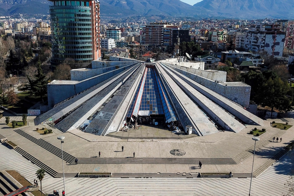 This aerial picture taken in Tirana, Albania, on February 7, 2019 shows a general view of Tirana's pyramid, a former museum that was named after late Albanian communist dictator Enver Hoxha. AFP / Gent Shkullaku 