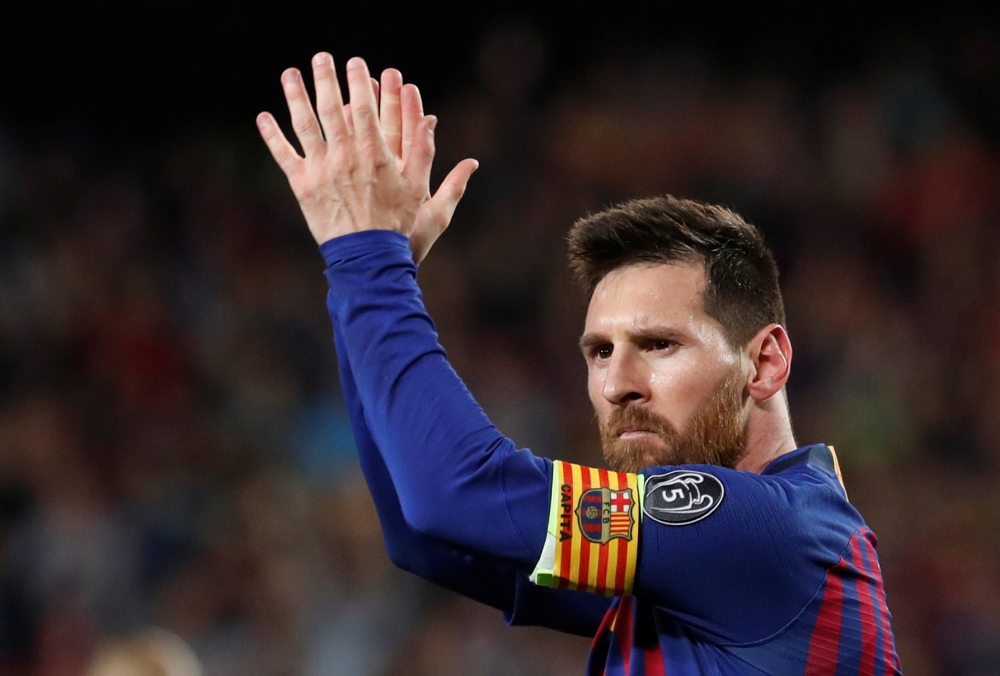Barcelona's Lionel Messi celebrates scoring their third goal. Reuters/Susana Vera