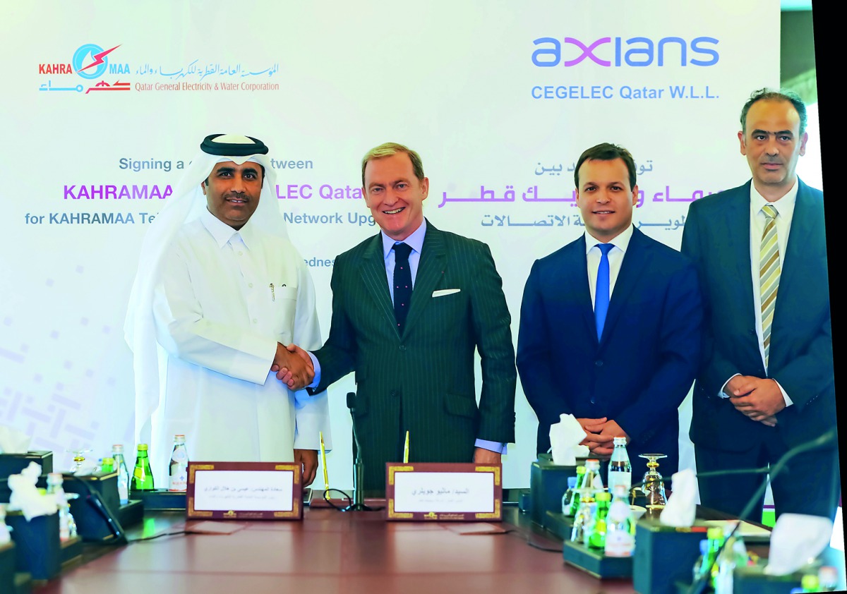 Essa bin Hilal Al Kuwari (left), Kahramaa’s President, with other officials after signing the contracts in Doha, yesterday.
