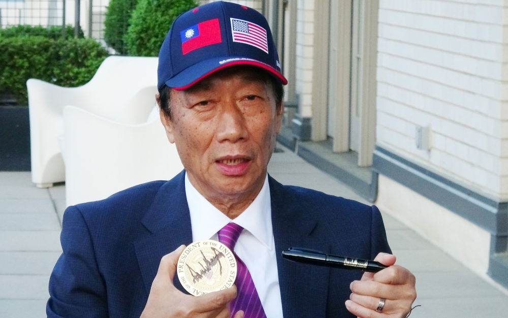 This CNA handout picture released on May 2, 2019 show Foxconn Chairman Terry Gou displaying a US president's signature outside the White House in Washington after meeting with US President Donald Trump. AFP PHOTO / CNA PHOTO