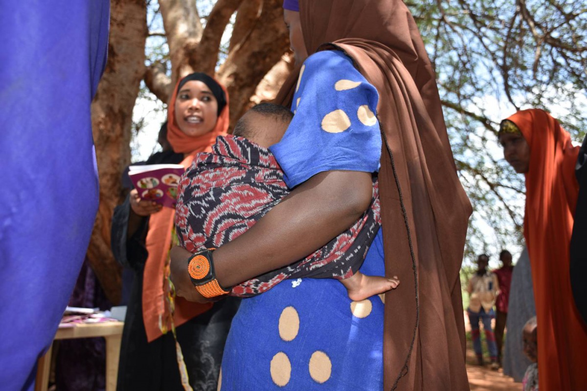 Alima Hossain, wearing a beaded solar-powered GPS bracelet, waits for her turn for health check-up in Yaballo Godha, Moyale, Kenya, April 8, 2019. Thomson Reuters Foundation/Munyaradzi Makoni