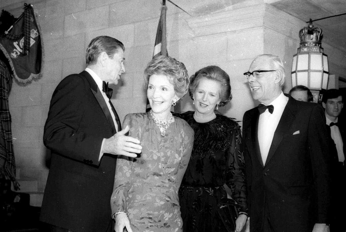 US President Ronald Reagan and Nancy Reagan escort Margaret Thatcher and husband Dennis to the British Embassy in Washington in this February 20, 1985 file photo.  Reuters / Charles Cancellare