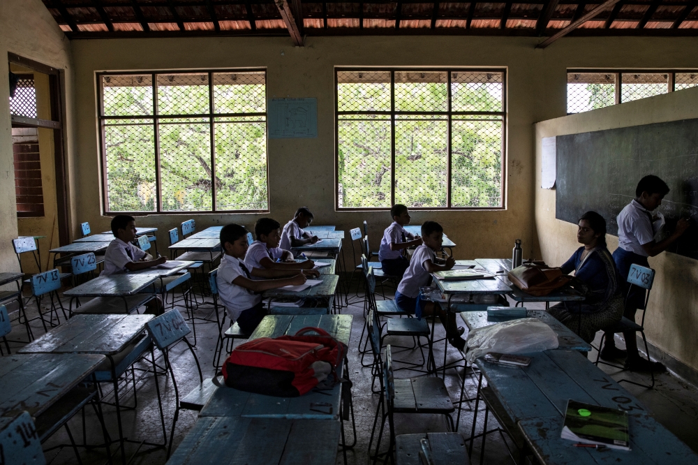 Few students are seen in an otherwise full clasroom at a school which opened days after a string of suicide bomb attacks across the island on Easter Sunday, in Batticaloa, Sri Lanka, May 6, 2019. Reuters/Danish Siddiqui