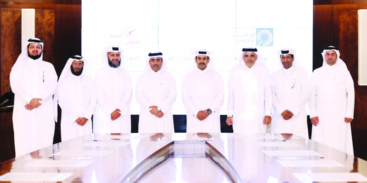 H E Saad bin Sherida Al Kaabi (fourth right), the Minister of State for Energy Affairs, the President & CEO of Qatar Petroleum; Essa bin Hilal Al Kuwari (third left) Kahramaa President; Fahad Hamad Al Muhannadi (third right), the Chairman of Umm Al Houl P