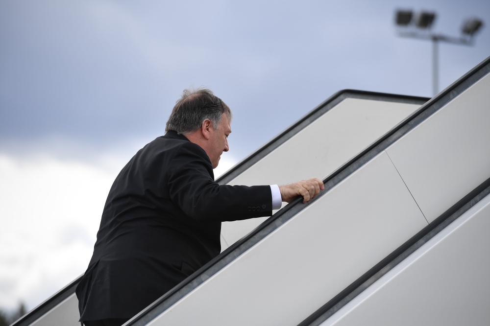 US Secretary of State Mike Pompeo makes his way to board a plane before departing from Rovaniemi Airport in Rovaniemi, Finland, after taking part in the 11th Ministerial Meeting of the Arctic Council on May 7, 2019. AFP / POOL / MANDEL NGAN