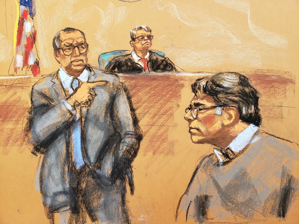 Defense attorney Marc Agnifilo (L) points in the direction of former self-help guru Keith Raniere, in this courtroom sketch, at the Brooklyn Federal Courthouse in New York, May 7, 2019. Reuters/Jane Rosenberg