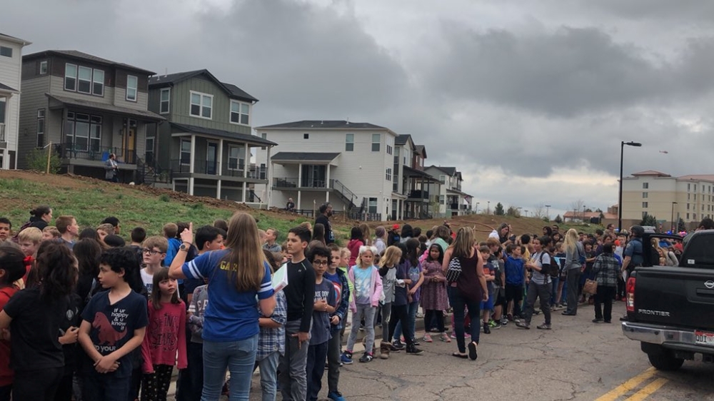 People wait outside near the STEM School during a shooting incident in Highlands Ranch, Colorado, U.S. in this May 7, 2019 image obtained via social media. SHREYA NALLAPATI/VIA REUTERS