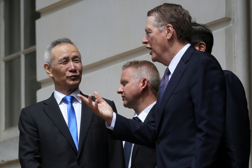 FILE PHOTO: China's Vice Premier Liu He listens to U.S. Trade Representative Robert Lighthizer as they exit the office of the U.S. Trade Representative following the second day of last-ditch trade talks in Washington, U.S., May 10, 2019. REUTERS/Leah Mill