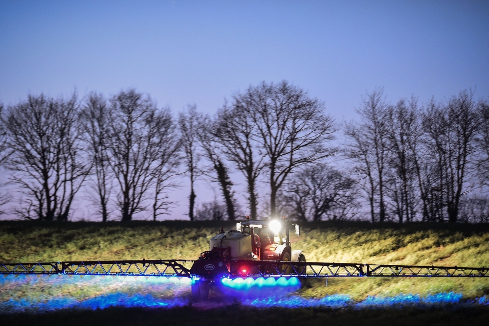 In this file photo taken on March 21, 2019, French farmer Fabien Denis sprays glyphosate herbicide made by the Monsanto agrochemical giant, roundup, to prepare a cornfield to be sowed in Saint-Leonard-des-Bois, northwestern France. AFP / Jean-Francois Mon