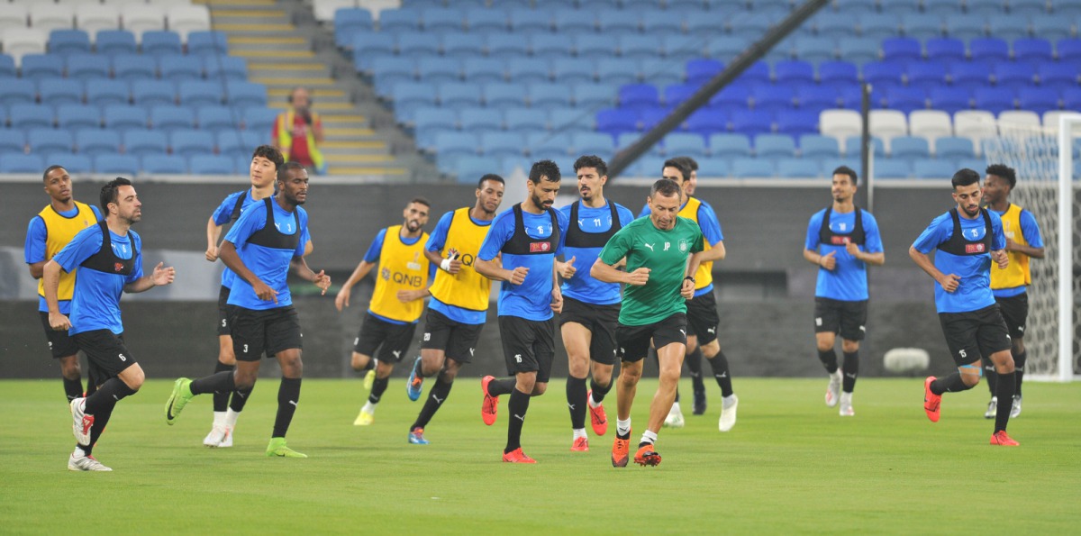 Al Sadd captain Xavi Hernandez (left) taking part in a training session on the eve of the Amir Cup final against Al Duhail in Doha yesterday.  