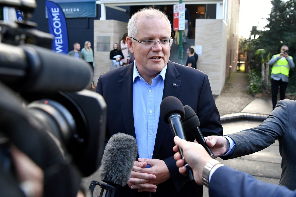 Australian Prime Minister Scott Morrison speaks to the media as he arrives at the Horizon Church in Sutherland in Sydney, Australia, May 19, 2019. AAP Image/Joel Carrett/via REUTERS 