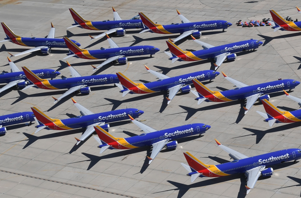 (FILES) In this file photo taken on March 28, 2019, Southwest Airlines Boeing 737 MAX aircraft are parked on the tarmac after being grounded, at the Southern California Logistics Airport in Victorville, California. AFP / Mark Ralston 