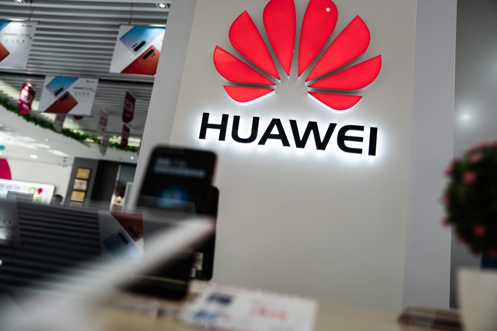 A Huawei logo is displayed at a retail store in Beijing on May 20, 2019. US internet giant Google, whose Android mobile operating system powers most of the world's smartphones, said it was beginning to cut ties with China's Huawei, which Washington consid