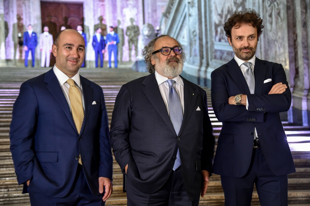 Italian luxury designer Stefano Ricci (C) poses with his sons Niccolo (R) and Filippo, during a preview of his Spring/Summer 2020 collection, at 'Reggia di Caserta', a UNESCO world heritage site and one of the great Royal Palaces of Europe, in Caserta nea