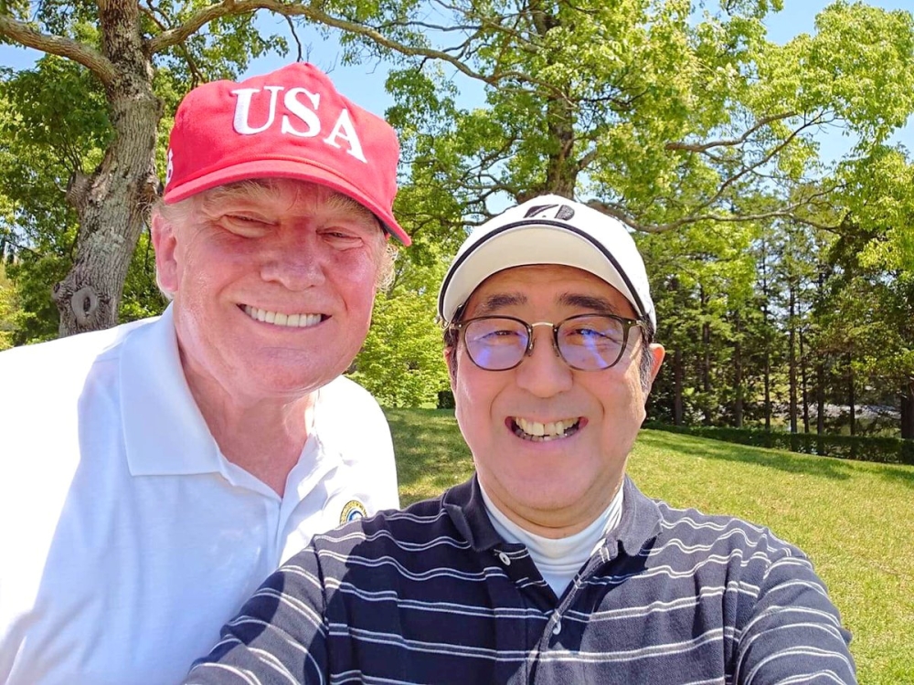 Japan's Prime Minister Shinzo Abe poses for a selfie with U.S. President Donald Trump at Mobara Country Club in Mobara, Chiba prefecture, Japan, May 26, 2019, in this picture obtained from social media. Courtesy of Instagram @kantei, Prime Minister's Offi