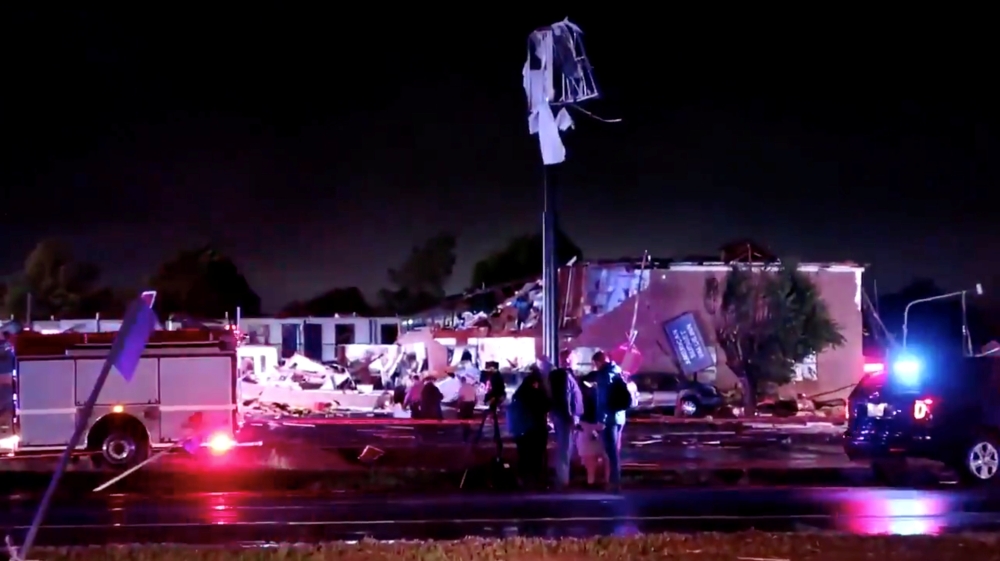 Emergency vehicles sit near a partially collapsed building after a tornado touched down in El Reno, Oklahoma, U.S., May 26, 2019 in this still image taken from social media video. Gale Vancampen via REUTERS