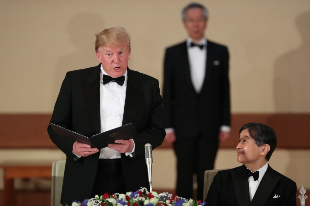 U.S. President Donald Trump speaks next to Japan's Emperor Naruhito during a state banquet at the Imperial Palace in Tokyo, Japan May 27, 2019. REUTERS/Jonathan Ernst