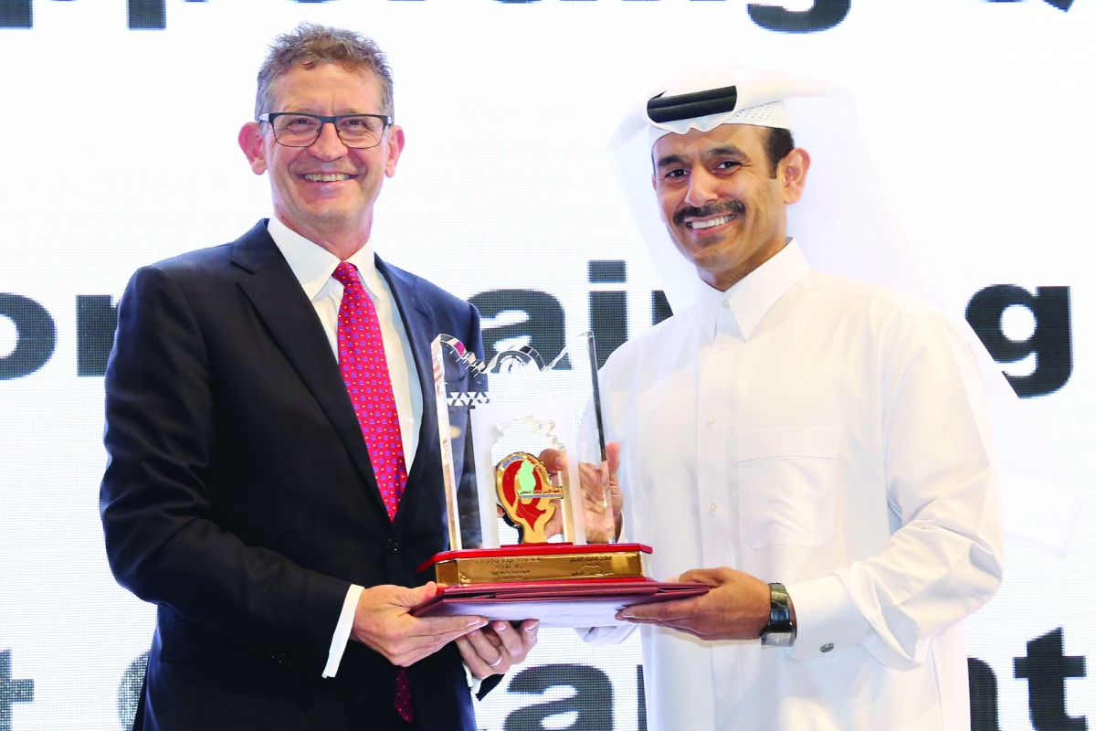H E Saad bin Sherida Al Kaabi, the Minister of State for Energy Affairs and President and CEO of Qatar Petroleum (QP), handing the award to Andrew Faulkner, Qatar Shell Managing Director and Chairman, at a ceremony.