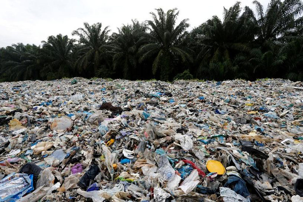 File photo of plastic waste piled outside an illegal recycling factory in Jenjarom, Kuala Langat, Malaysia October 14, 2018.REUTERS/Lai Seng Sin/File Photo