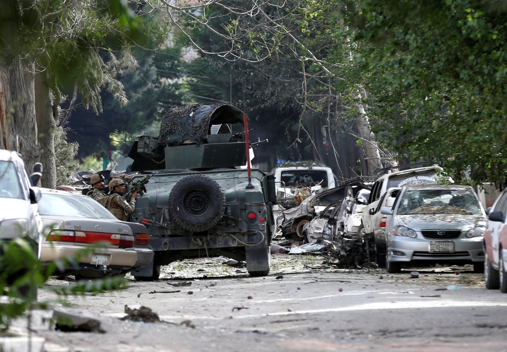 FILE PHOTO: Afghan security forces take position during an attack by gunmen in Kabul, Afghanistan, May 8, 2019.REUTERS/Mohammad Ismail