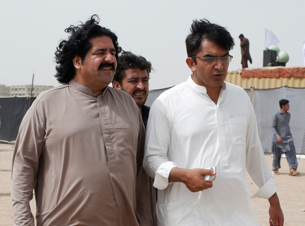 FILE PHOTO: Ali Wazir (L) and Mohsin Dawar, leaders of the Pashtun Tahaffuz Movement (PTM) walk at the venue of a rally against, what they say, are human rights violations by security forces, in Karachi, Pakistan May 13, 2018. Picture taken May 13, 2018. 