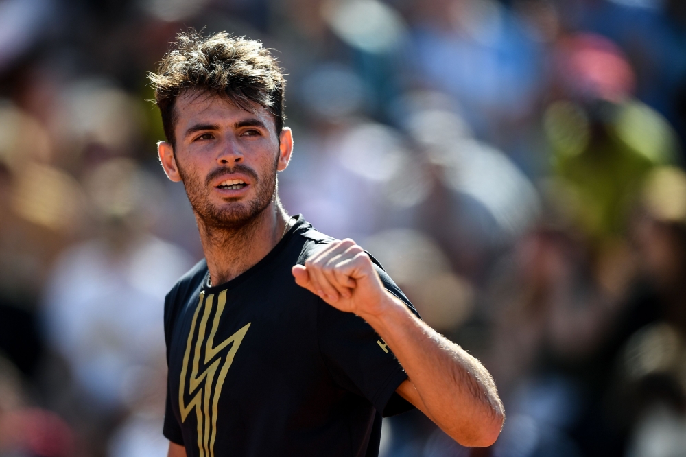 Argentina's Juan Ignacio Londero celebrates after winning against France's Corentin Moutet at the end of their men's singles third round match on day six of The Roland Garros 2019 French Open tennis tournament in Paris on May 31, 2019. AFP / Anne-Christin