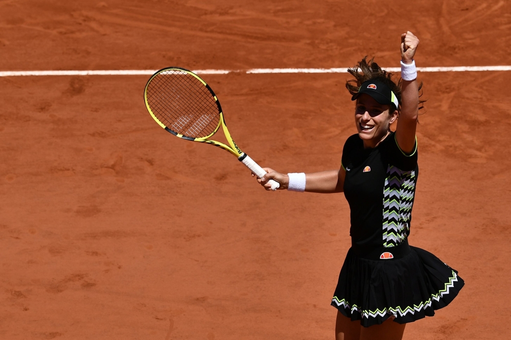 Britain's Johanna Konta celebrates after winning against Croatia's Donna Vekic at the end of their women's singles fourth round match on day eight of The Roland Garros 2019 French Open tennis tournament in Paris on June 2, 2019. / AFP / Philippe LOPEZ