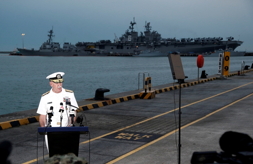Admiral Scott Swift, Commander of the U.S. Pacific Fleet, speaks at a news conference near the damaged USS John McCain and the USS America at Changi Naval Base in Singapore August 22, 2017. Reuters/Calvin Wong 