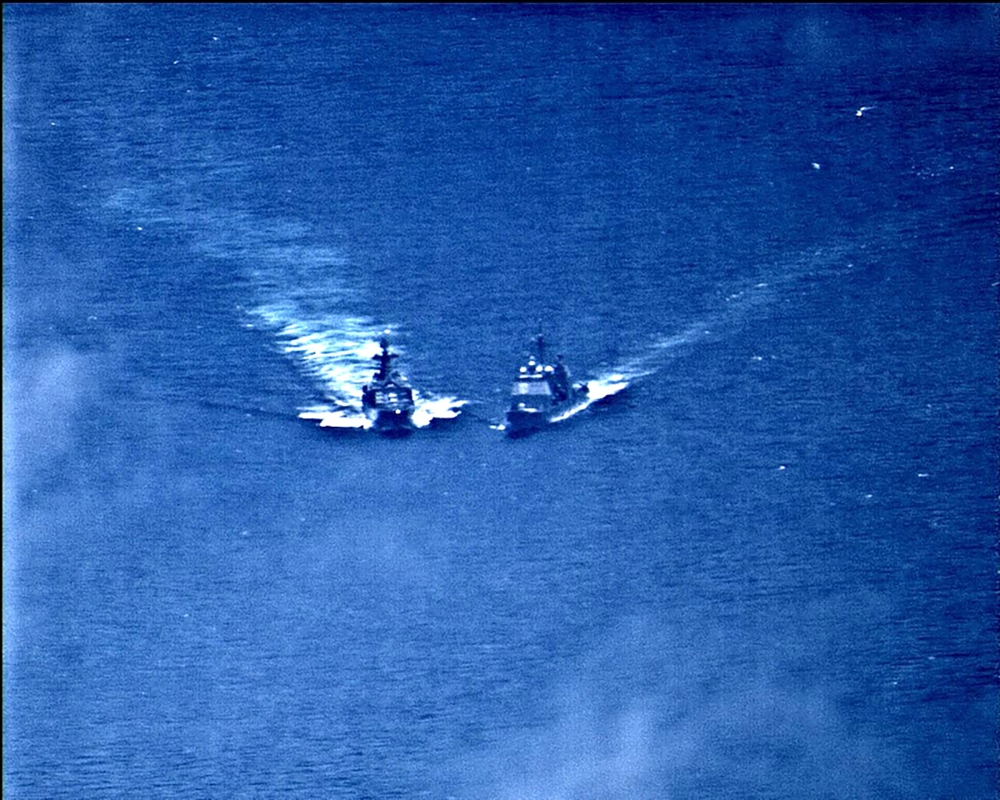A surveillance photo shows the Russian naval destroyer Udaloy making what the U.S. Navy describes as an unsafe maneuver against the Ticonderoga-class guided-missile cruiser USS Chancellorsville in the Philippine Sea June 7, 2019. U.S. Navy/Handout via Reu