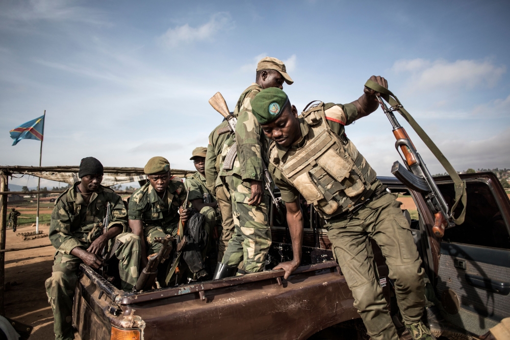 Democratic Republic of the Congo armed forces soldiers FARDC prepare to escort health workers attached to ebola response programs on May 18, 2019 in Butembo, north of Kivu. AFP/John Wessels