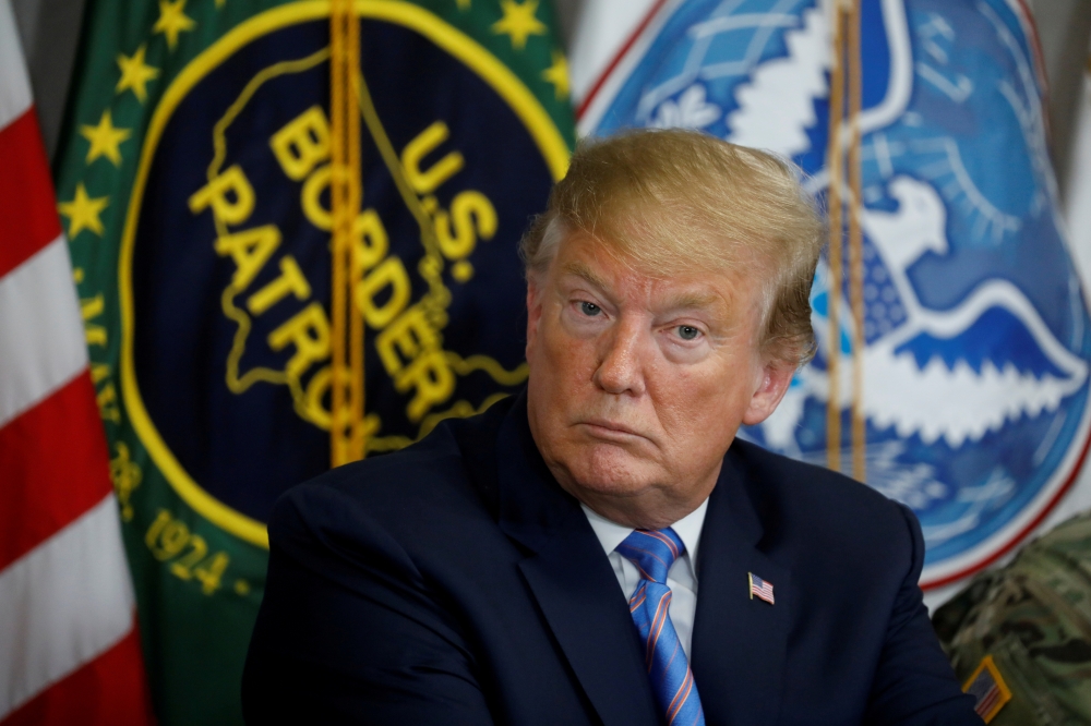 FILE PHOTO: US President Donald Trump participates in a roundtable discussion on immigration and border security at the U.S. Border Patrol Calexico Station before visiting the U.S.-Mexico border in Calexico, California, U.S., April 5, 2019. Reuters/Kevin 