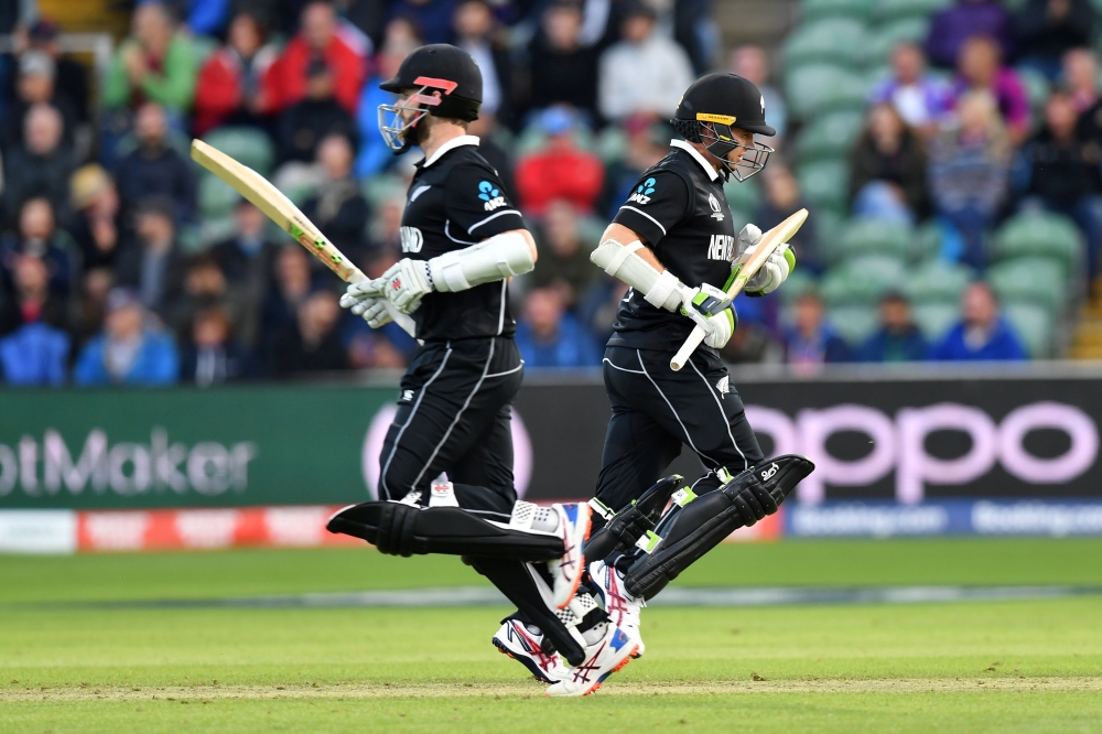 New Zealand's captain Kane Williamson (L) and New Zealand's Tom Latham run between wickets during the 2019 Cricket World Cup group stage match between Afghanistan and New Zealand at The County Ground in Taunton, southwest England, on June 8, 2019. AFP / S