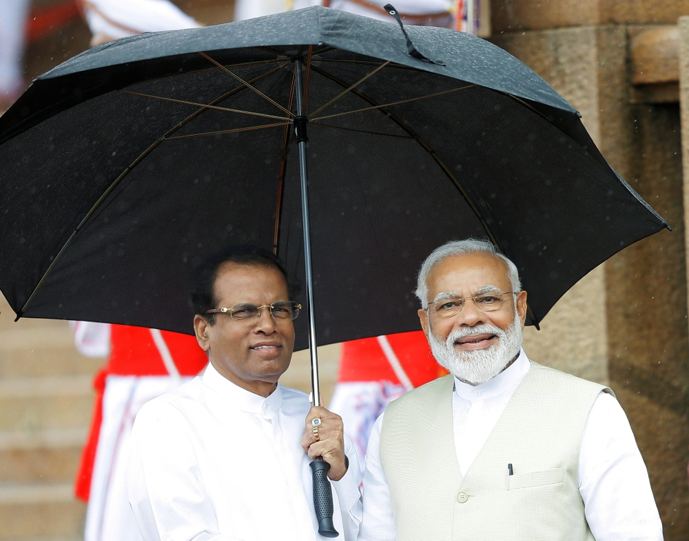 India's Prime Minister Narendra Modi is seen with Sri Lanka's President Maithripala Sirisena during his welcome ceremony at the Presidential Secretariat in Colombo, Sri Lanka, June 9, 2019. REUTERS/ Dinuka Liyanawatte