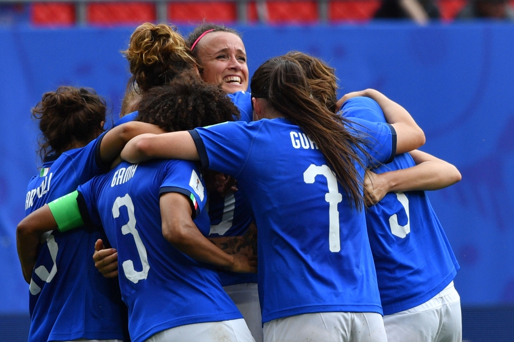 Italy's midfielder Barbara Bonansea (C) is congratulated by teammates after scoring the decisive goal during the France 2019 Women's World Cup Group C football match between Australia and Italy, on June 9, 2019, at the Hainaut Stadium in Valenciennes, nor