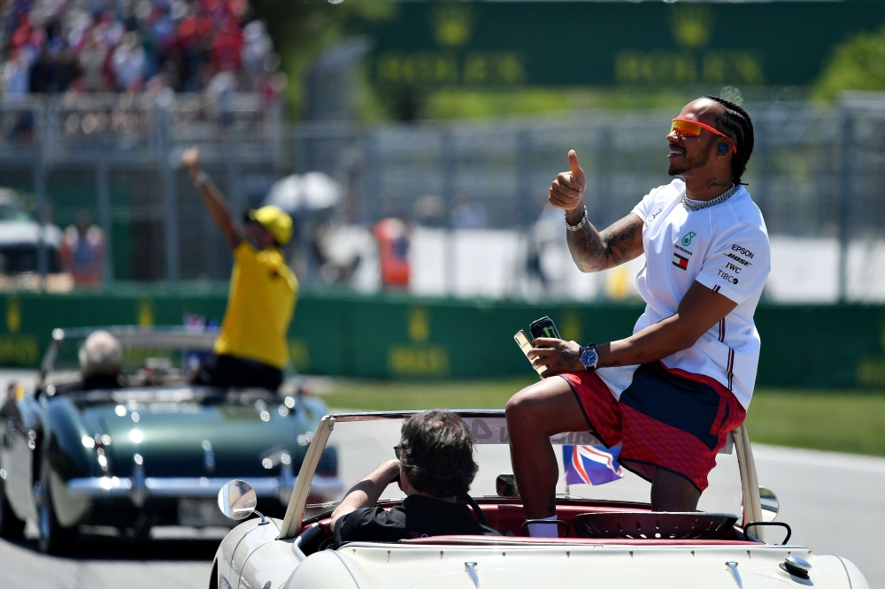 Lewis Hamilton of Great Britain and Mercedes GP waves to the crowd on the driver's parade before the F1 Grand Prix of Canada at Circuit Gilles Villeneuve on June 09, 2019 in Montreal, Canada. Dan Mullan/AFP