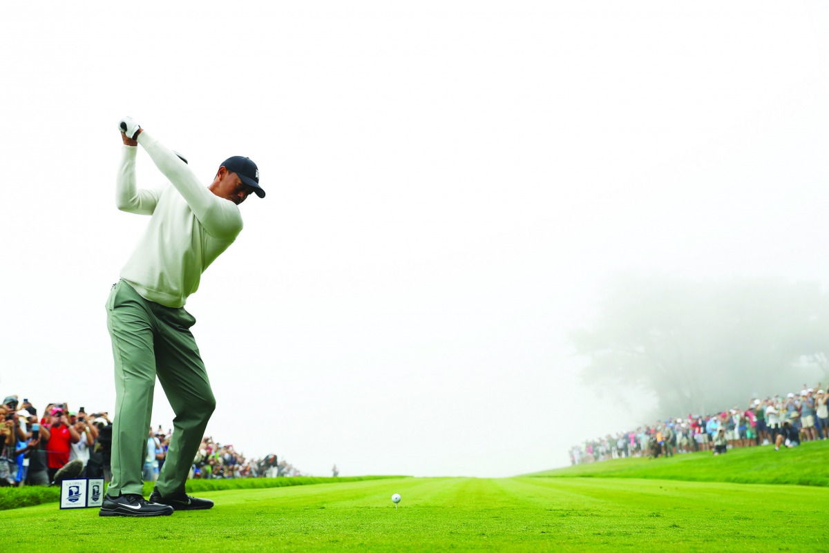  Tiger Woods of the United States plays a shot from the 14th tee during a practice round prior to the 2019 U.S. Open at Pebble Beach Golf Links on June 12, 2019 in Pebble Beach, California. Warren Little/Getty Images/AFP