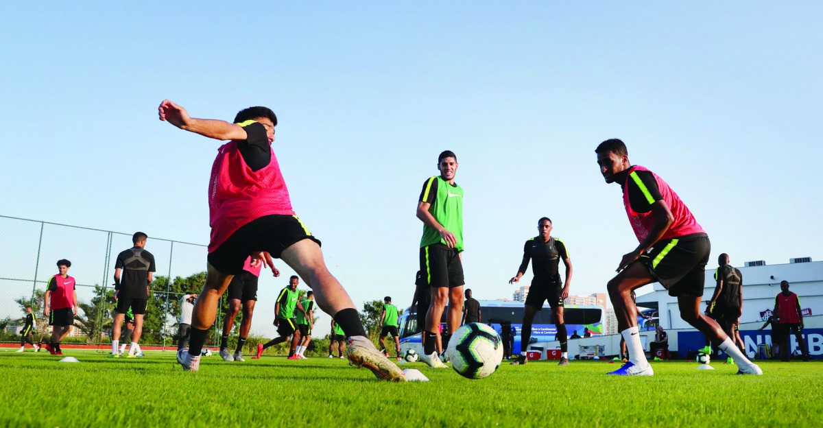 Qatari midfielder Karim Boudiaf (centre) takes part in a training session along with his team-mates in Rio de Janeiro ahead of their opening match of the 2019 Copa America against Paraguay, which will be played at the historic Maracana Stadium today.