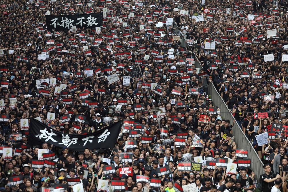 Thousands of protesters dressed in black take part in a new rally against a controversial extradition law proposal in Hong Kong on June 16, 2019. AFP / Dale De La Rey 