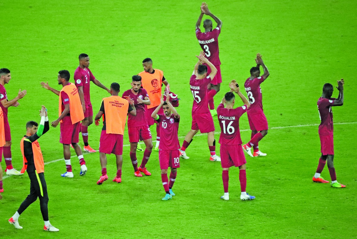 Qatari players applaud fans after drawing their opening Group B match of 2019 Copa America against Paraguay at the Maracana Stadium in Rio de Janeiro, Brazil, on Sunday.