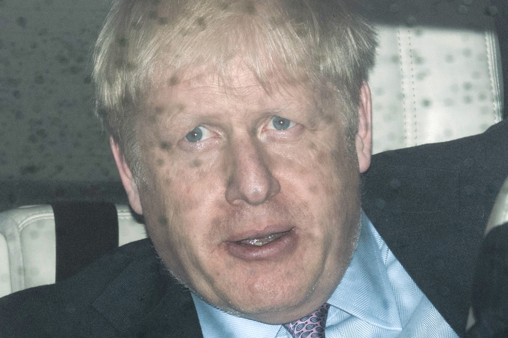 Conservative leadership contender Boris Johnson leaves the Houses of Parliament in central London on June 18, 2019.  AFP / Daniel Leal-Olivas