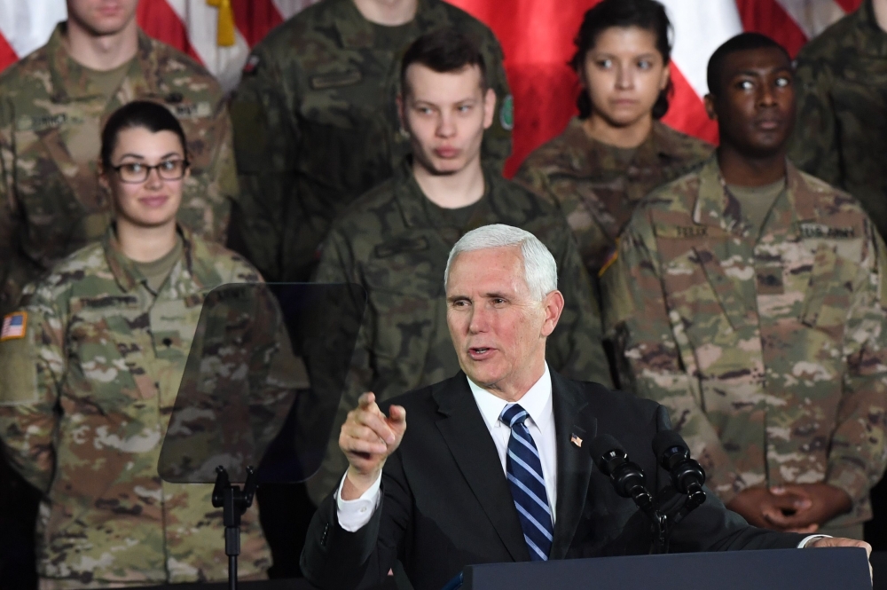 US Vice President Mike Pence delivers a speech at the 1st Airlift Base in Warsaw on February 13, 2019 during a three-day visit of the US Vice President to Poland (AFP/Janek Skarzynski) 