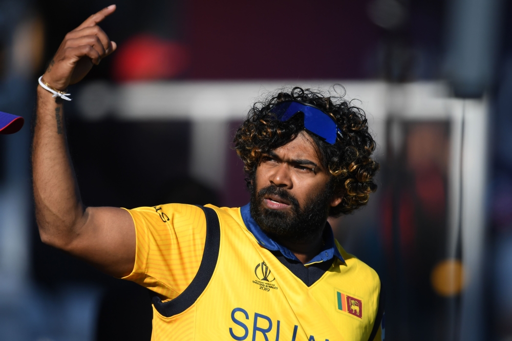 Sri Lanka's Lasith Malinga gestures on the field as Sri Lanka's players celebrate their win after the 2019 Cricket World Cup group stage match between England and Sri Lanka at Headingley in Leeds, northern England, on June 21, 2019. AFP / Dibyangshu Sarka
